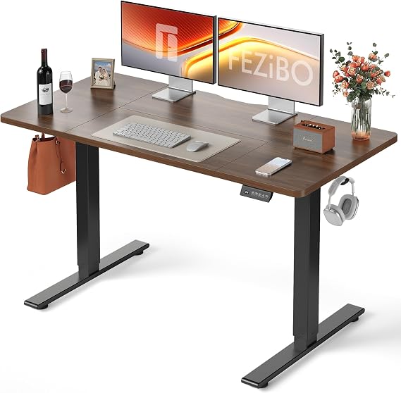 FEZIBO Electric Height Adjustable Standing Desk with digital display control panel, 70x140cm Ergonomic Home Office Table for sit stand with Splice Board & BlackWalnut Wood Grain Surface